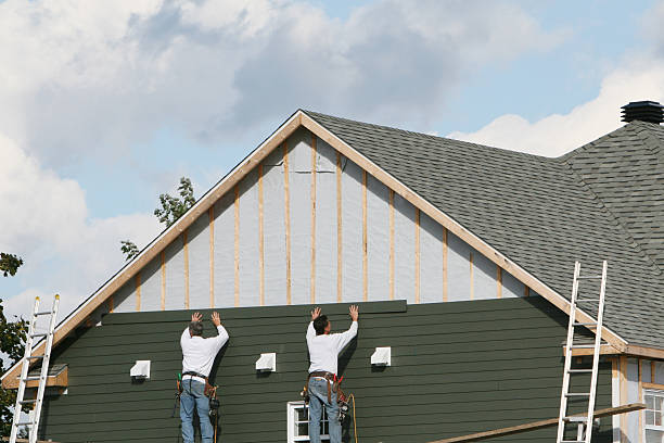 Professional Siding technician working in Clinton, IL